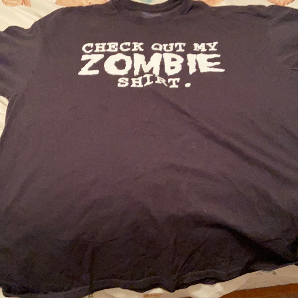 100% cotton check out my zombie shirt Spencer’s